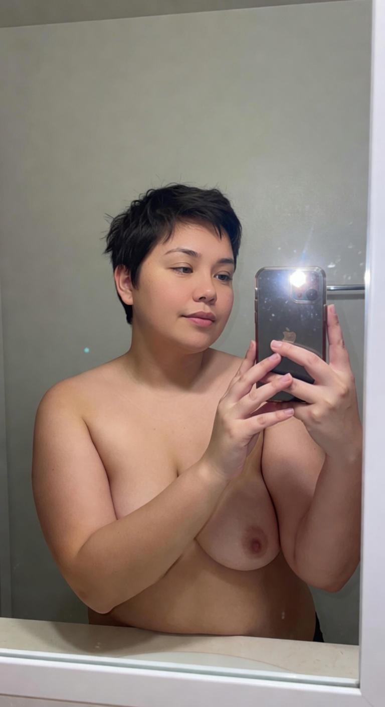 Amateur Bathroom tits photo roasted by AI: The tits are bold. That bathroom mirror selfie with the shower caddy crammed wit...